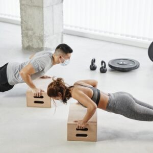 full-shot-man-woman-doing-push-ups_23-2148801851